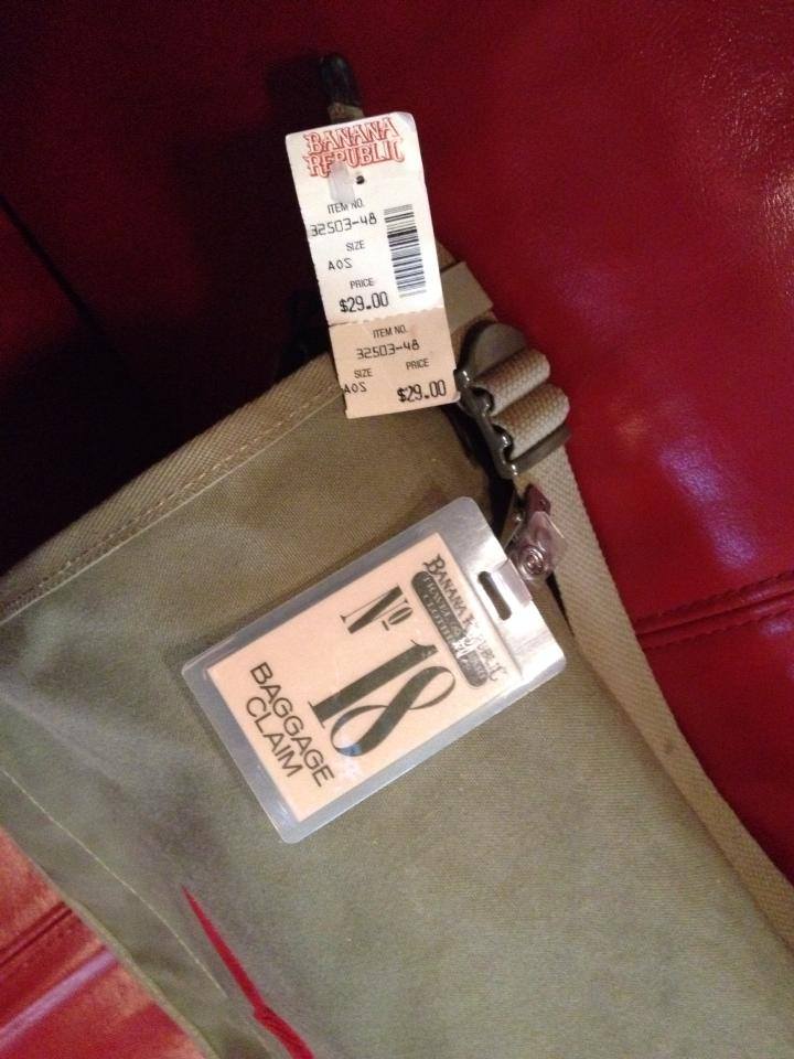 I display it with an authentic bag-check tag I bought from a shopper who nabbed it from one of the Manhattan locations. 