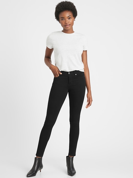 Image number 1 showing, Petite Mid-Rise Skinny Fade-Resistant Ankle Jean