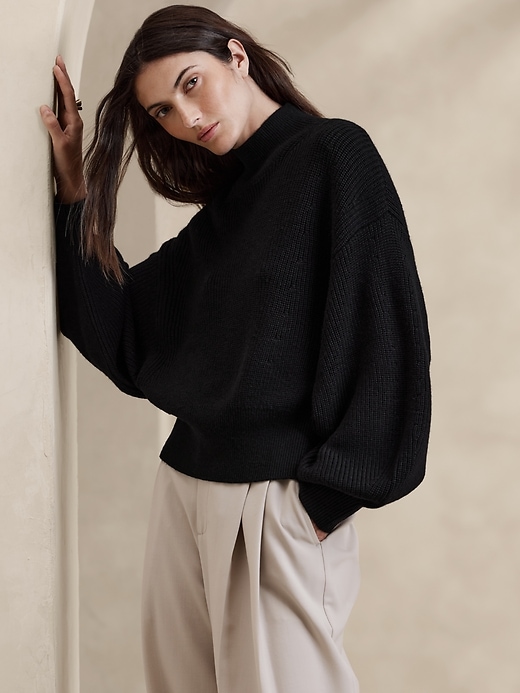 1 of 8 showing, with the color Black of product Landa Merino Sweater